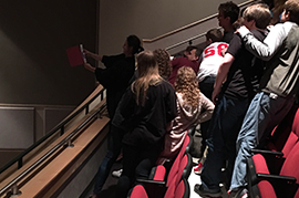 Justice Wood takes a selfie with students.