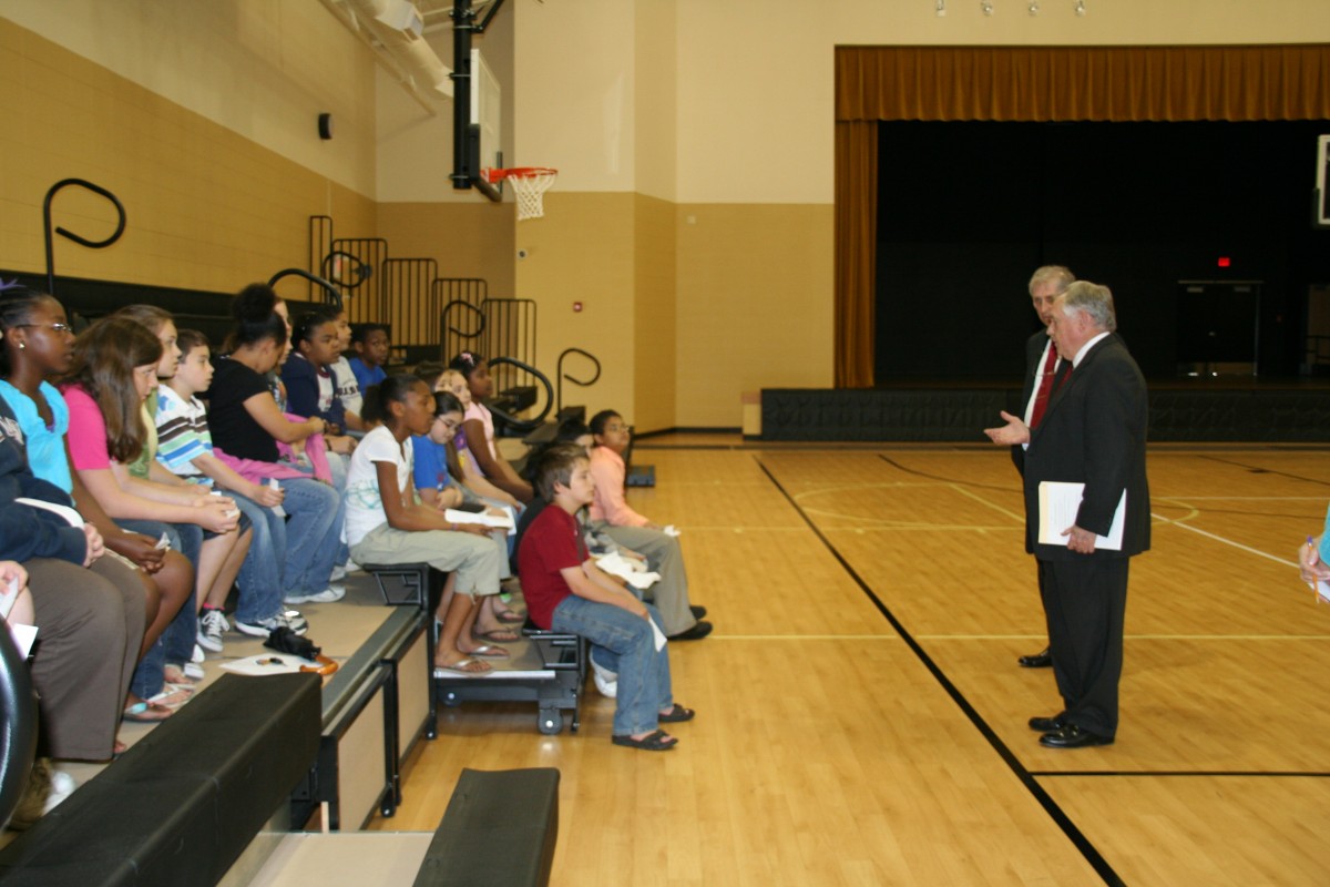 Justice Paul Danielson and Justice Jim Gunter speak with students