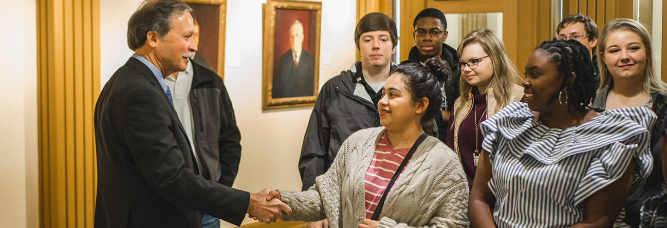 Arkansas Supreme Court Chief Justice John Dan Kemp greets students visiting the Justice Building